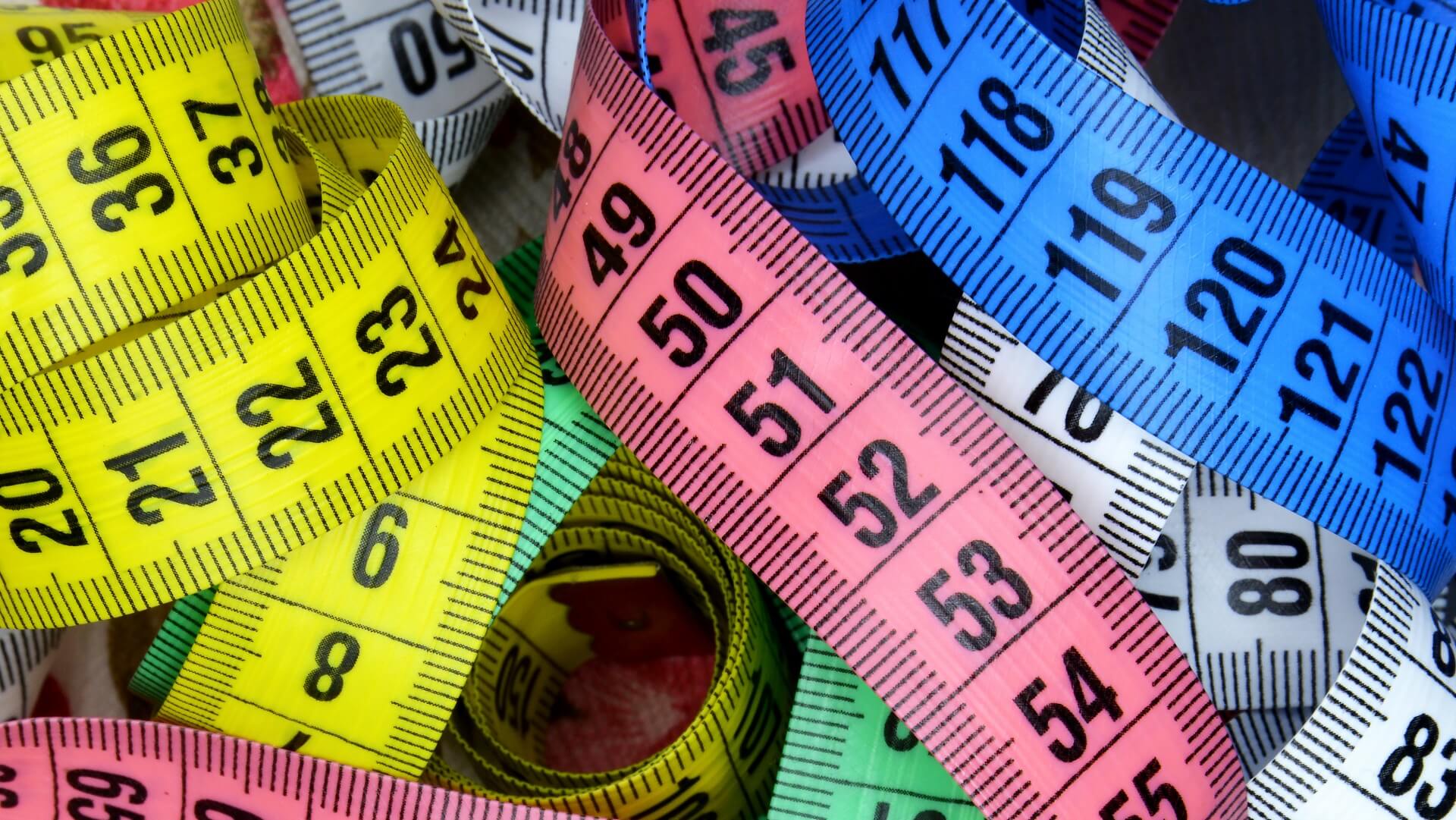 several colourful measuring tapes
